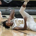 
              Colorado forward Jabari Walker hits the floor while trying to corral the ball in the first first half of an NCAA college basketball game against Washington, Sunday, Jan. 9, 2022, in Boulder, Colo. (AP Photo/David Zalubowski)
            