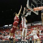 
              Washington State forward Mouhamed Gueye, right, shoots between Stanford forward Spencer Jones, left, and forward Lukas Kisunas during the first half of an NCAA college basketball game, Thursday, Jan. 13, 2022, in Pullman, Wash. (AP Photo/Young Kwak)
            