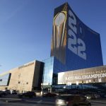 
              The College Football Playoff National Championship event logo is displayed on the outside of the JW Marriott, Friday, Jan. 7, 2022, in Indianapolis. Alabama and Georgia are scheduled to play in the championship game on Jan. 10 at Lucas Oil Stadium. (AP Photo/Darron Cummings)
            