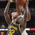 
              Southern California forward Isaiah Mobley, top, and California guard Jalen Celestine battle for a rebound during the second half of an NCAA college basketball game Saturday, Jan. 29, 2022, in Los Angeles. (AP Photo/Mark J. Terrill)
            