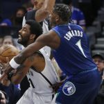 
              Minnesota Timberwolves forward Anthony Edwards (1) fouls Brooklyn Nets guard Kyrie Irving in the first quarter of an NBA basketball game, Sunday, Jan. 23, 2022, in Minneapolis. (AP Photo/Bruce Kluckhohn)
            