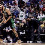 
              Boston Celtics forward Jayson Tatum (0) reacts to a scoring play against the New Orleans Pelicans in the fourth quarter of an NBA basketball game in New Orleans, Saturday, Jan. 29, 2022. (AP Photo/Derick Hingle)
            