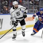 
              Los Angeles Kings defenseman Drew Doughty (8) looks to pass in front of New York Islanders right wing Cal Clutterbuck in the second period of an NHL hockey game Thursday, Jan. 27, 2022, in Elmont, N.Y. (AP Photo/Adam Hunger)
            