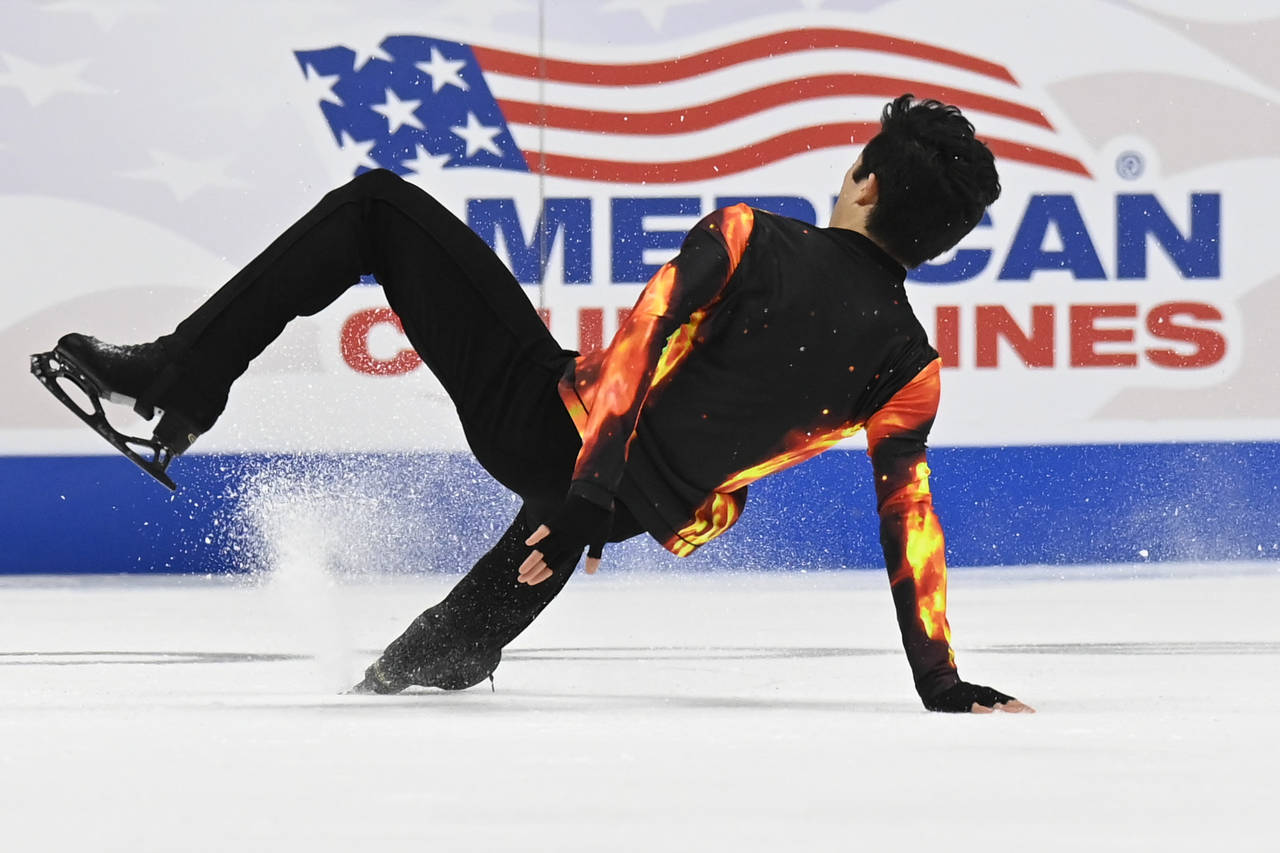 Nathan Chen falls in the men's free skate program during the U.S. Figure Skating Championships Sund...