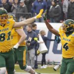 
              North Dakota State tight end Josh Babicz (81) congratulates running back Kobe Johnson (4) after Johnson's long touchdown run against Montana State during the first half of the FCS Championship NCAA college football game in Frisco, Texas, Saturday, Jan. 8, 2022. (AP Photo/Michael Ainsworth)
            