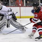 
              Los Angeles Kings goaltender Cal Petersen clears the puck in front of New Jersey Devils left wing Jesper Bratt (63) during the second period of an NHL hockey game Sunday, Jan. 23, 2022, in Newark, N.J. (AP Photo/Adam Hunger)
            