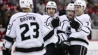 Los Angeles Kings right wing Carl Grundstrom (91) is congratulated by teammates after scoring a goa...