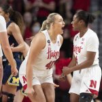 
              Nebraska's Alexis Markowski (40) and Sam Haiby (4) celebrate after drawing a foul and making the basket against Michigan during the first half of an NCAA college basketball game Tuesday, Jan. 4, 2022, in Lincoln, Neb. (AP Photo/Rebecca S. Gratz)
            