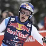 
              FILE - Switzerland's Marco Odermatt celebrates at the finish area of an alpine ski, men's World Cup downhill, in Kitzbuehel, Austria, on Jan. 23, 2022. ( Looking for the Next Big Thing in Alpine skiing? Look no further than Marco Odermatt. The 24-year-old from Switzerland is a potential superstar who won five gold medals at the junior world championships in 2018 and is currently leading the overall World Cup standings. He’s a legitimate medal threat in three events at the upcoming Beijing Olympics with strong results in giant slalom, super-G and downhill this season. (AP Photo/Giovanni Auletta, File)
            