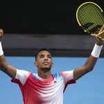 
              Felix Auger-Aliassime of Canada celebrates after defeating Marin Cilic of Croatia in their fourth round match at the Australian Open tennis championships in Melbourne, Australia, Monday, Jan. 24, 2022. (AP Photo/Simon Baker)
            