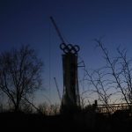 
              Olympic Rings assembled atop of a structure stand out near a ski resort on the outskirts of Beijing, China, Thursday, Jan. 13, 2022. The Chinese capital is gearing up for the Winter Olympics the midst of COVID-19 outbreaks in several Chinese cities which have been locked down. (AP Photo/Ng Han Guan)
            