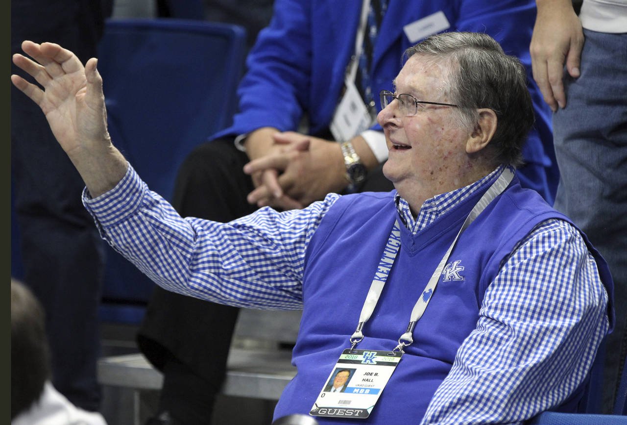 FILE - Former Kentucky coach Joe B. Hall waves to the crowd during the first half of the team's NCA...