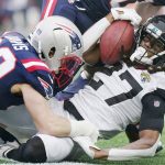
              Jacksonville Jaguars cornerback Chris Claybrooks (27) is taken down by New England Patriots defensive back Cody Davis (22) during the first half of an NFL football game, Sunday, Jan. 2, 2022, in Foxborough, Mass. (AP Photo/Steven Senne)
            