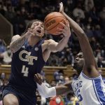 
              Georgia Tech guard Jordan Usher (4) drives to the basket while Duke center Mark Williams (15) defends during the first half of an NCAA college basketball game in Durham, N.C., Tuesday, Jan. 4, 2022. (AP Photo/Gerry Broome)
            