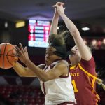 
              Oklahoma guard Nevaeh Tot (1) grabs a rebound in front of Iowa State forward Morgan Kane, right, in the first half of an NCAA college basketball game Wednesday, Jan. 5, 2022, in Norman, Okla. (AP Photo/Sue Ogrocki)
            