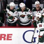 
              Minnesota Wild right wing Ryan Hartman (38) celebrates with teammates after scoring a goal against the Chicago Blackhawks during the first period of an NHL hockey game in Chicago, Friday, Jan. 21, 2022. (AP Photo/Nam Y. Huh)
            