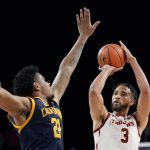 
              Southern California forward Isaiah Mobley, right, shoots as California forward Andre Kelly defends during the second half of an NCAA college basketball game Saturday, Jan. 29, 2022, in Los Angeles. (AP Photo/Mark J. Terrill)
            