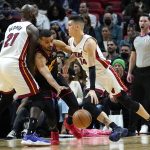 
              Miami Heat guard Tyler Herro (14) drives to the basket as Atlanta Hawks guard Timothe Luwawu-Cabarrot, left, defends during the first half of an NBA basketball game, Friday, Jan. 14, 2022, in Miami. (AP Photo/Lynne Sladky)
            