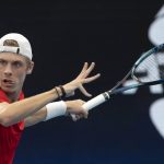 
              Denis Shapovalov of Canada plays a shot against Russia's Roman Safiullin during their semifinal match at the ATP Cup tennis tournament in Sydney, Saturday, Jan. 8, 2022. (AP Photo/Steve Christo)
            