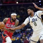 
              New Orleans Pelicans forward Brandon Ingram drives to the basket against Utah Jazz forward Rudy Gay (8) in the first half of an NBA basketball game in New Orleans, Monday, Jan. 3, 2022. (AP Photo/Gerald Herbert)
            