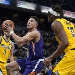 
              Phoenix Suns' Devin Booker goes to the basket against Indiana Pacers' Myles Turner (33) during the second half of an NBA basketball game, Friday, Jan. 14, 2022, in Indianapolis. (AP Photo/Darron Cummings)
            