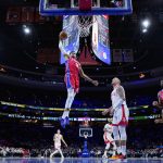
              Philadelphia 76ers' Tobias Harris, left, goes up for a dunk past Houston Rockets' Daniel Theis during the first half of an NBA basketball game, Monday, Jan. 3, 2022, in Philadelphia. (AP Photo/Matt Slocum)
            