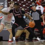 
              IUPUI's Chuks Isitua, right, posts up against Ohio State's Joey Brunk during the second half of an NCAA college basketball game Tuesday, Jan. 18, 2022, in Columbus, Ohio. (AP Photo/Jay LaPrete)
            