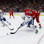 
              Toronto Maple Leafs left wing Michael Bunting (58) tries to pass the puck to right wing Ilya Mikheyev (65) while being pressured by Detroit Red Wings defenseman Moritz Seider (53) during the second period of an NHL hockey game Saturday, Jan. 29, 2022, in Detroit. (AP Photo/Duane Burleson)
            