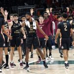 
              Florida State forward Malik Osborne (10) celebrates with his teammates after an NCAA college basketball game against Miami, Saturday, Jan. 22, 2022, in Coral Gables, Fla. Florida State won 61-60. (AP Photo/Lynne Sladky)
            