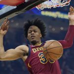 
              Cleveland Cavaliers' Isaac Okoro dunks against the Brooklyn Nets in the first half of an NBA basketball game, Monday, Jan. 17, 2022, in Cleveland. (AP Photo/Tony Dejak)
            