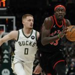 
              Toronto Raptors' Pascal Siakam drivers past Milwaukee Bucks' Donte DiVincenzo during the first half of an NBA basketball game Saturday, Jan. 15, 2022, in Milwaukee. (AP Photo/Morry Gash)
            