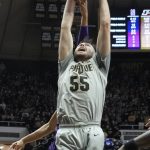
              Purdue guard Sasha Stefanovic (55) pulls down a rebound in front of Northwestern guard Chase Audige (1) in the first half of an NCAA college basketball game in West Lafayette, Ind., Sunday, Jan. 23, 2022. (AP Photo/AJ Mast)
            