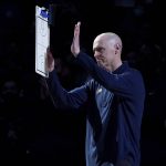 
              Indiana Pacers head coach Rick Carlisle acknowledges cheers from fans after a video tribute honoring Carlisle's time in Dallas was showed on the large in-house video screen before the first half of an NBA basketball game against the Dallas Mavericks in Dallas, Saturday, Jan. 29, 2022. (AP Photo/Tony Gutierrez)
            