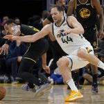 
              Utah Jazz forward Bojan Bogdanovic (44) loses the ball after being fouled by Golden State Warriors guard Jordan Poole, left, during the first half of an NBA basketball game in San Francisco, Sunday, Jan. 23, 2022. (AP Photo/Jeff Chiu)
            