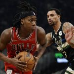 
              Chicago Bulls' Ayo Dosunmu drives past Milwaukee Bucks' George Hill during the first half of an NBA basketball game Friday, Jan. 21, 2022, in Milwaukee. (AP Photo/Morry Gash)
            