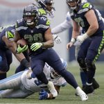
              Seattle Seahawks running back Rashaad Penny rushes against the Detroit Lions during the first half of an NFL football game, Sunday, Jan. 2, 2022, in Seattle. (AP Photo/John Froschauer)
            