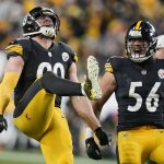 
              Pittsburgh Steelers outside linebacker T.J. Watt (90) celebrates with outside linebacker Alex Highsmith (56) after sacking Cleveland Browns quarterback Baker Mayfield in the first half of an NFL football game, Monday, Jan. 3, 2022, in Pittsburgh. (AP Photo/Gene J. Puskar)
            