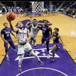
              Kansas State guard Markquis Nowell (1) puts up a shot during the second half of an NCAA college basketball game against TCU Wednesday, Jan. 12, 2022, in Manhattan, Kan. TCU won 60-57. (AP Photo/Charlie Riedel)
            