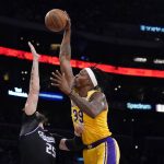
              Los Angeles Lakers center Dwight Howard (39) goes up for a dunk as Sacramento Kings center Alex Len (25) defends during the first half of an NBA basketball game Tuesday, Jan. 4, 2022, in Los Angeles. (AP Photo/Marcio Jose Sanchez)
            
