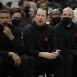 
              Toronto Raptors coach Nick Nurse, middle, reacts to a call during the first half of the team's NBA basketball game against the Milwaukee Bucks on Wednesday, Jan. 5, 2022, in Milwaukee. (AP Photo/Aaron Gash)
            