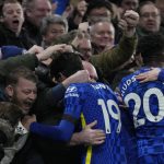 
              Chelsea players celebrate with their fans after Chelsea's Thiago Silva scored their side's second goal during the English Premier League soccer match between Chelsea and Tottenham Hotspur at Stamford Bridge stadium in London, England, Sunday, Jan. 23, 2022. (AP Photo/Kirsty Wigglesworth)
            