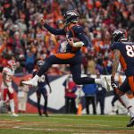 
              Denver Broncos quarterback Drew Lock, middle, celebrates with wide receiver Tim Patrick (81) after scoring against the Kansas City Chiefs during the first half of an NFL football game Saturday, Jan. 8, 2022, in Denver. (AP Photo/Jack Dempsey)
            