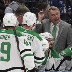 
              Dallas Stars head coach Rick Bowness talks to his players during the third period of an NHL hockey game against the Tampa Bay Lightning Saturday, Jan. 15, 2022, in Tampa, Fla. (AP Photo/Chris O'Meara)
            