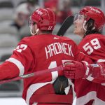 
              Detroit Red Wings left wing Tyler Bertuzzi (59) is congratulated by Filip Hronek (17) after scoring a goal against the San Jose Sharks during the second period of an NHL hockey game Tuesday, Jan. 11, 2022, in San Jose, Calif. (AP Photo/Tony Avelar)
            