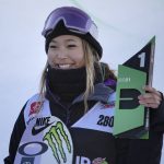 
              FILE - Chloe Kim, of the United States, holds the first place finish following the snowboarding halfpipe finals, Sunday, Dec. 19, 2021, during Dew Tour at Copper Mountain, Colo. Shaun White is likely heading to the Olympics for a fifth time. For the first time, the snowboarding star and three-time gold medalist on the halfpipe won't be the favorite. That won't be the case on the women's side, where Chloe Kim will attempt to defend the gold that she claimed with such ease in Korea four years ago. (AP Photo/Hugh Carey, FIle)
            