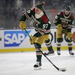 
              Minnesota Wild left wing Kirill Kaprizov warms up for the team's NHL Winter Classic hockey game against the St. Louis Blues on Saturday, Jan. 1, 2022, at Target Field in Minneapolis. (AP Photo/Andy Clayton-King)
            