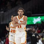 
              Atlanta Hawks guard Trae Young (11) reacts after making a 3-pointer during the second half of the team's NBA basketball game against the Minnesota Timberwolves on Wednesday, Jan. 19, 2022, in Atlanta. (AP Photo/Hakim Wright Sr.)
            