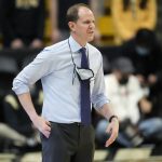 
              Washington head coach Mike Hopkins directs his team against Colorado in the first first half of an NCAA college basketball game Sunday, Jan. 9, 2022, in Boulder, Colo. (AP Photo/David Zalubowski)
            