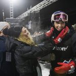 
              Scotty James celebrates with his fiancé Chloe Stroll after winning a gold medal in men's snowboard superpipe at the 2022 Winter X Games in Aspen on Friday, Jan. 21, 2022. (Kelsey Brunner/The Aspen Times via AP)
            