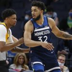 
              Minnesota Timberwolves center Karl-Anthony Towns (32) posts up against Utah Jazz forward Rudy Gay, left, in the first quarter of an NBA basketball game Sunday, Jan. 30, 2022, in Minneapolis. (AP Photo/Bruce Kluckhohn)
            